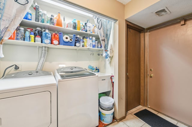 1351 4th St W, Hastings, MN 55033 - washroom with washer and dryer and light tile patterned flooring