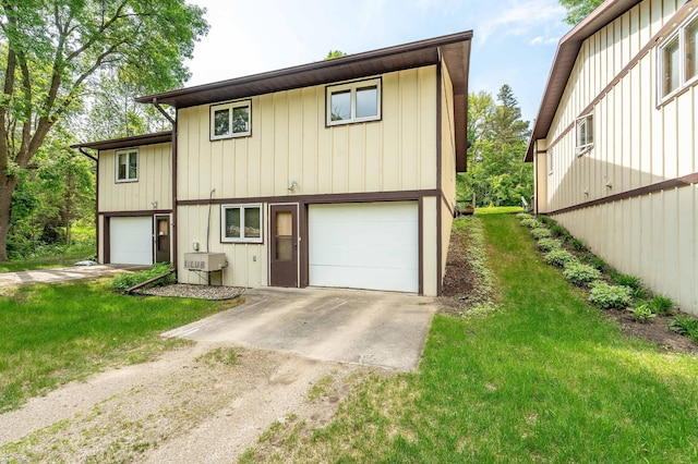 415 2nd Ave SE, Pelican Rapids, MN 56572 - view of front of property featuring driveway, a front yard, and board and batten siding