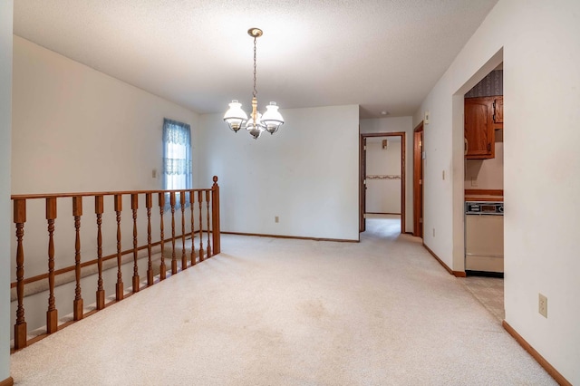 415 2nd Ave SE, Pelican Rapids, MN 56572 - unfurnished room featuring light carpet, a chandelier, and baseboards
