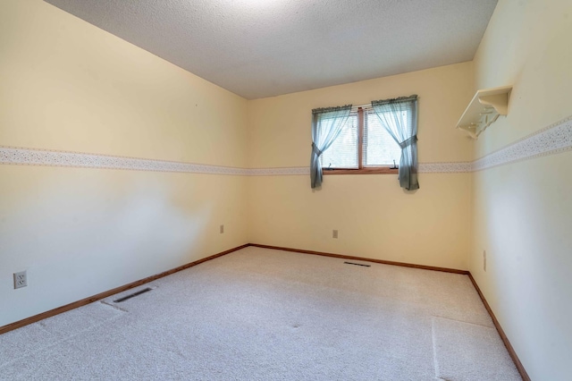 415 2nd Ave SE, Pelican Rapids, MN 56572 - carpeted empty room with a textured ceiling and baseboards
