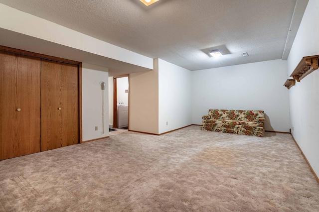 415 2nd Ave SE, Pelican Rapids, MN 56572 - unfurnished room featuring a textured ceiling, washer / dryer, carpet floors, and baseboards
