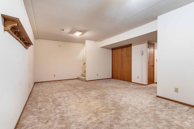 415 2nd Ave SE, Pelican Rapids, MN 56572 - carpeted empty room featuring stairs, a textured ceiling, and baseboards