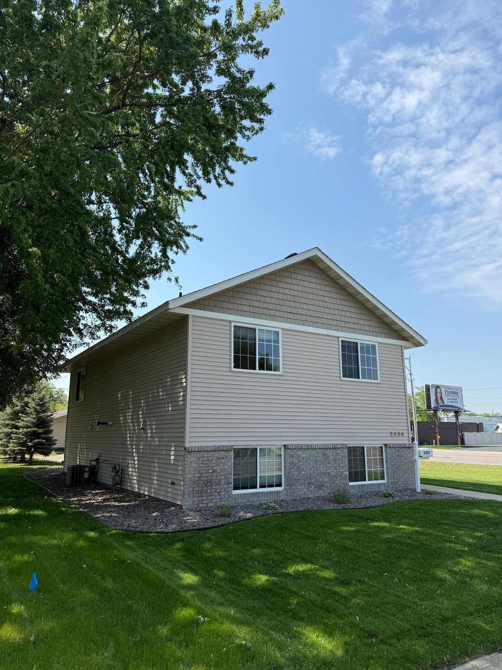 2434 1st St S, Saint Cloud, MN 56301 - view of side of home with a yard