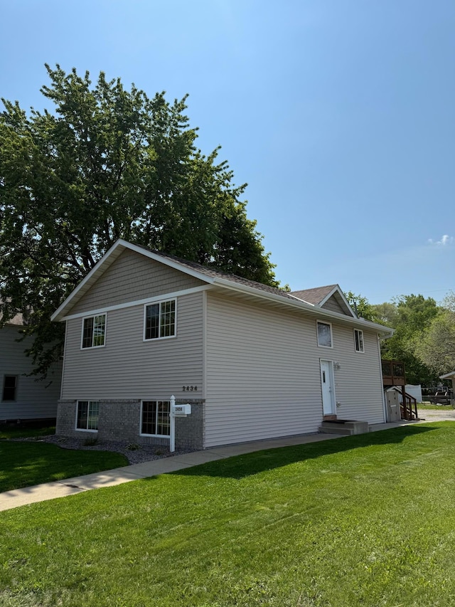 2434 1st St S, Saint Cloud, MN 56301 - view of home's exterior with a yard