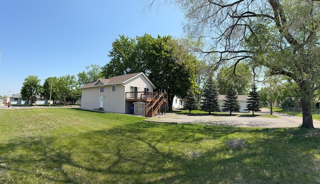 2434 1st St S, Saint Cloud, MN 56301 - view of green lawn featuring stairway and a deck