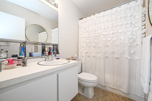 15 1st St Unit A1119, Minneapolis, MN 55401 - full bath featuring vanity, toilet, tile patterned floors, and curtained shower