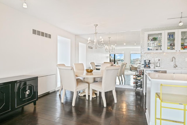 15 1st St Unit A1119, Minneapolis, MN 55401 - dining area featuring a chandelier and dark wood-style floors