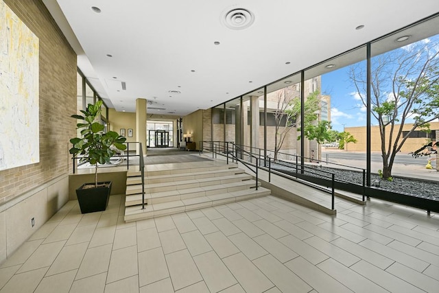 15 1st St Unit A1119, Minneapolis, MN 55401 - common area featuring a wall of windows and brick wall