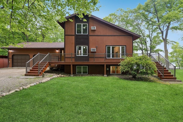6844 140th Ave NE, Spicer, MN 56288 - rear view of house featuring stairway, a lawn, a wooden deck, a garage, and gravel driveway