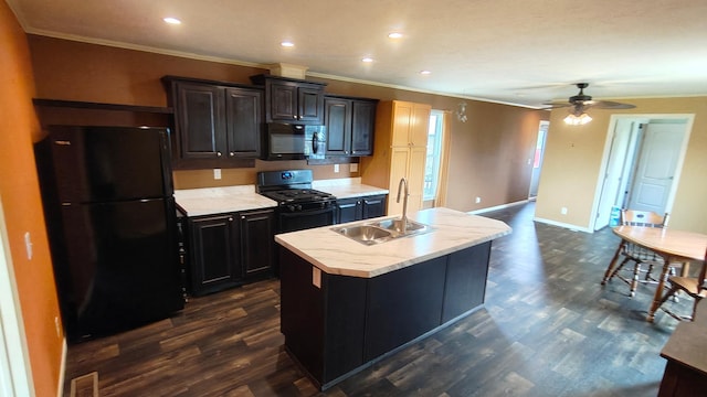 13786 188th Pl, Williams Twp, MN 56350 - kitchen featuring black appliances, a sink, light countertops, a kitchen island with sink, and crown molding