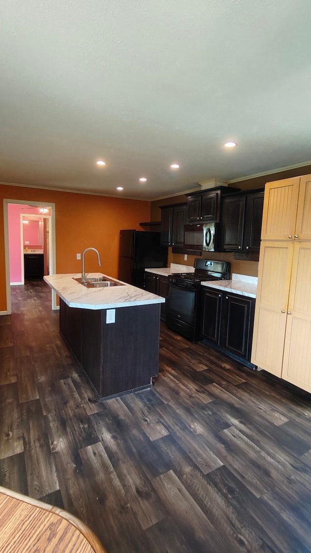 13786 188th Pl, Williams Twp, MN 56350 - kitchen with black appliances, a sink, an island with sink, dark wood-style flooring, and recessed lighting