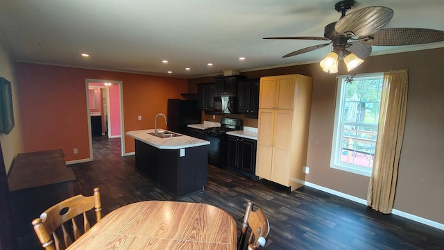 13786 188th Pl, Williams Twp, MN 56350 - kitchen featuring black appliances, ceiling fan, a center island with sink, ornamental molding, and baseboards