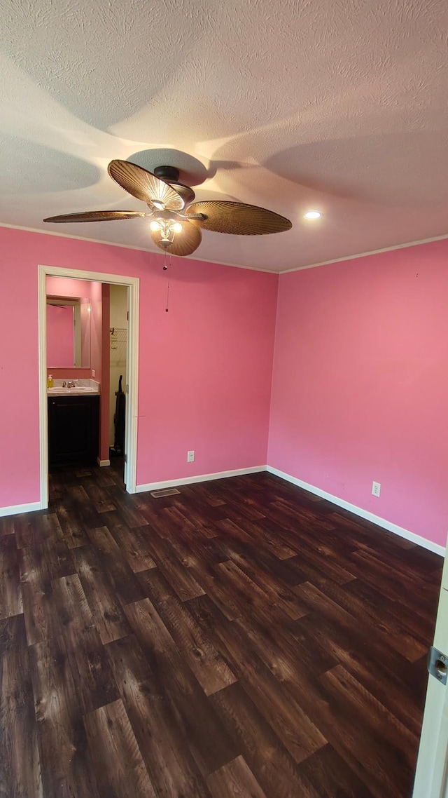 13786 188th Pl, Williams Twp, MN 56350 - unfurnished room featuring dark wood-style floors, a ceiling fan, a textured ceiling, and baseboards