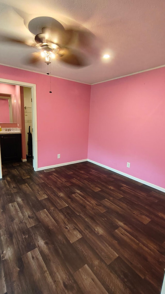 13786 188th Pl, Williams Twp, MN 56350 - spare room with dark wood-style flooring, a ceiling fan, baseboards, and recessed lighting