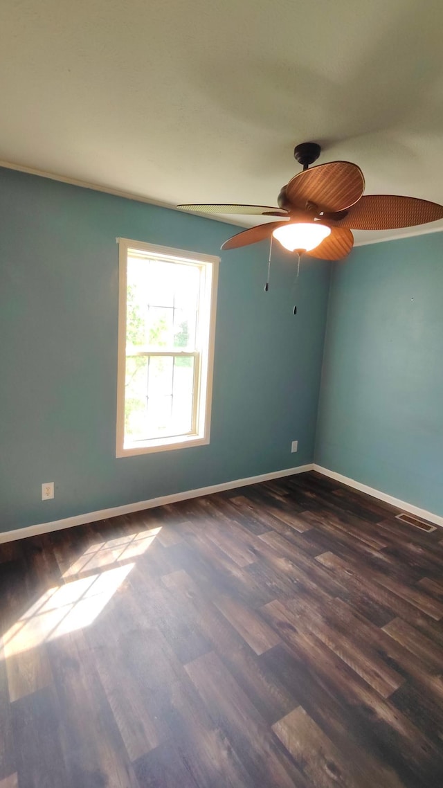 13786 188th Pl, Williams Twp, MN 56350 - spare room with dark wood-style floors, a ceiling fan, and baseboards