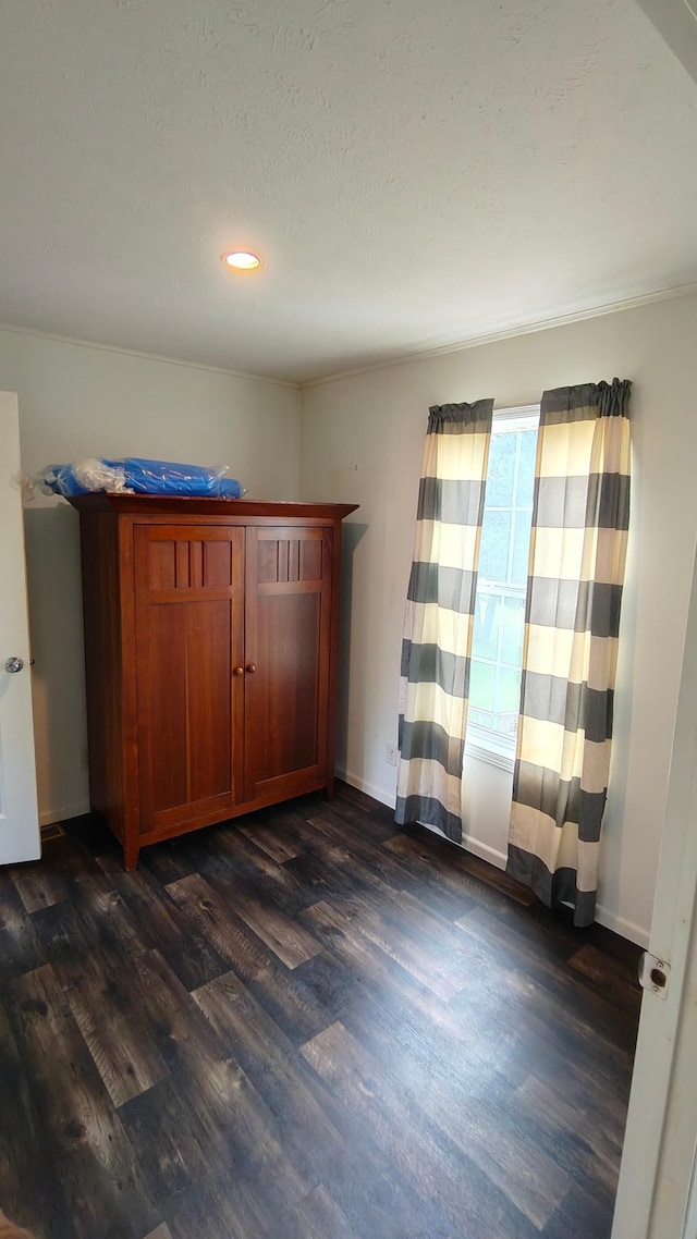 13786 188th Pl, Williams Twp, MN 56350 - unfurnished bedroom with dark wood-type flooring, recessed lighting, and baseboards