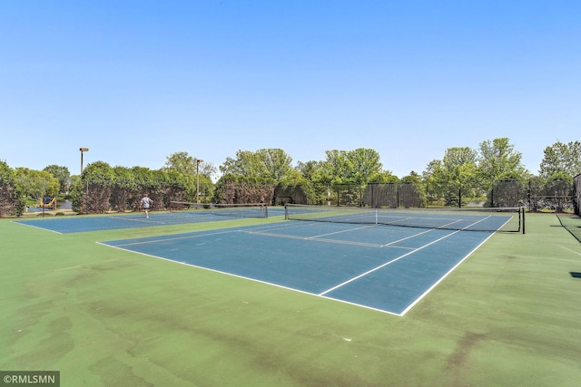 11206 Baltimore St NE Unit A, Blaine, MN 55449 - view of tennis court with community basketball court