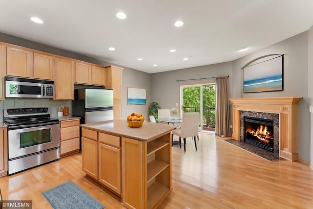 11206 Baltimore St NE Unit A, Blaine, MN 55449 - kitchen featuring stainless steel appliances, light brown cabinetry, light wood-style flooring, recessed lighting, and open shelves