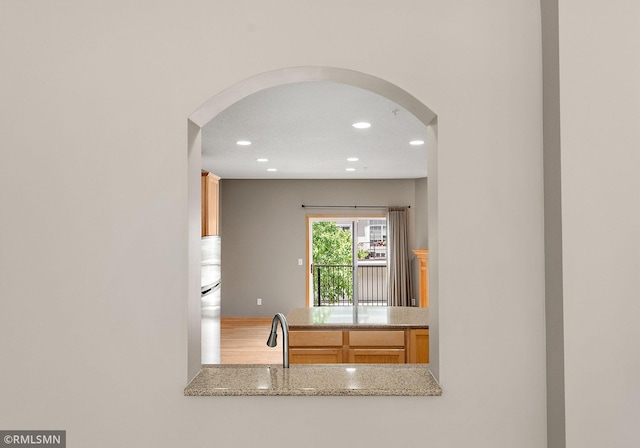 11206 Baltimore St NE Unit A, Blaine, MN 55449 - kitchen with arched walkways, freestanding refrigerator, recessed lighting, and a sink