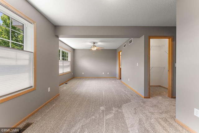 11206 Baltimore St NE Unit A, Blaine, MN 55449 - carpeted spare room featuring ceiling fan and baseboards