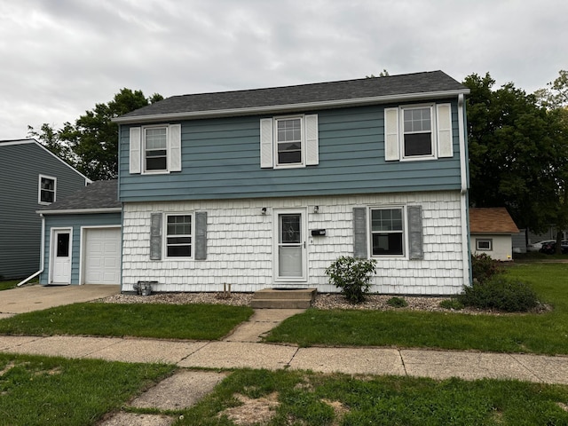 1110 Sherman St, Jackson, MN 56143 - colonial-style house featuring an attached garage, a front yard, driveway, and a shingled roof