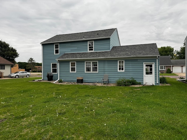 1110 Sherman St, Jackson, MN 56143 - rear view of property featuring a lawn