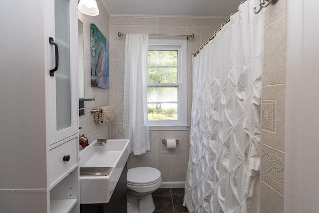 5349 47th Ave S, Minneapolis, MN 55417 - bathroom with toilet, vanity, tile walls, tile patterned floors, and a shower with shower curtain