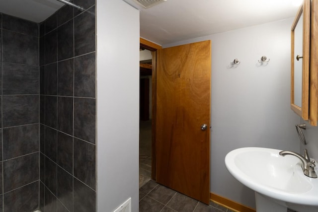 5349 47th Ave S, Minneapolis, MN 55417 - full bath featuring tiled shower, a sink, and tile patterned floors