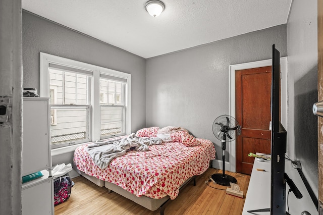 3725 Fremont Ave N, Minneapolis, MN 55412 - bedroom featuring a textured wall and wood-type flooring