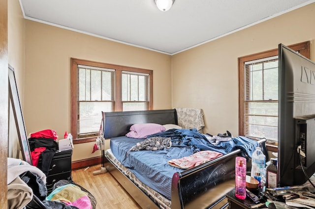 3725 Fremont Ave N, Minneapolis, MN 55412 - bedroom featuring crown molding and light wood-style flooring