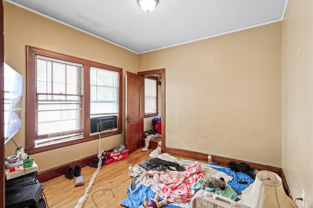 3725 Fremont Ave N, Minneapolis, MN 55412 - bedroom with crown molding, wood finished floors, and cooling unit