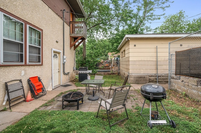 3725 Fremont Ave N, Minneapolis, MN 55412 - view of patio featuring an outdoor fire pit, grilling area, and a balcony