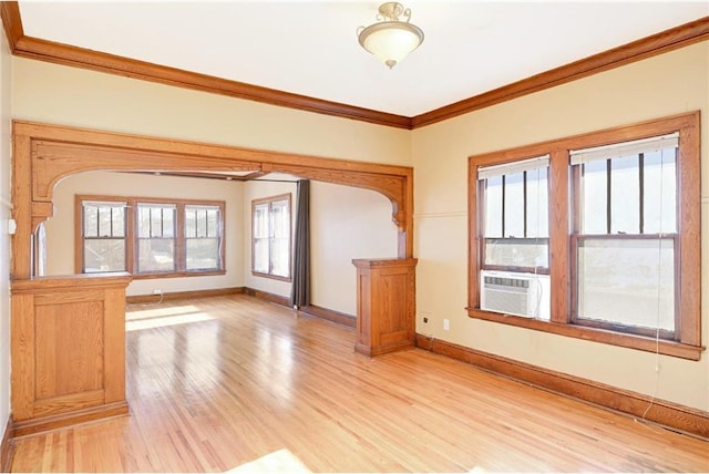 3725 Fremont Ave N, Minneapolis, MN 55412 - empty room with crown molding, light wood finished floors, cooling unit, plenty of natural light, and baseboards
