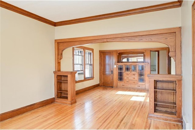3725 Fremont Ave N, Minneapolis, MN 55412 - spare room featuring crown molding, baseboards, healthy amount of natural light, and light wood finished floors