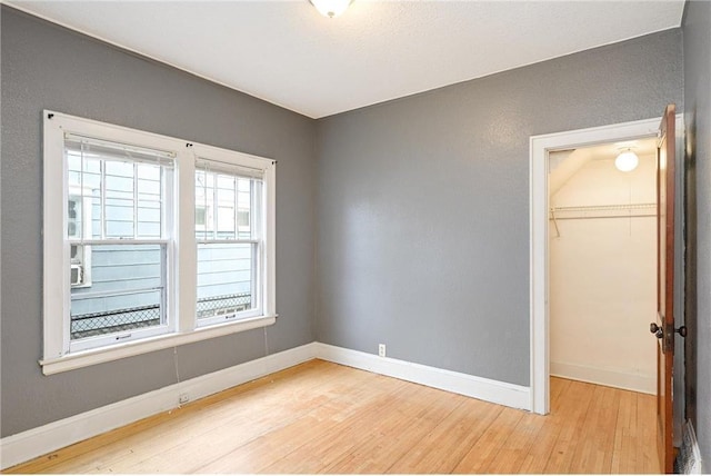 3725 Fremont Ave N, Minneapolis, MN 55412 - unfurnished bedroom with wood finished floors, baseboards, and a closet