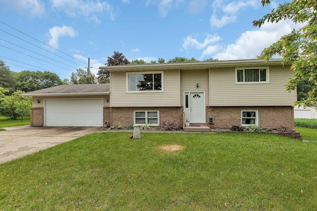 11236 207th Ave NW, Elk River, MN 55330 - split foyer home with an attached garage, concrete driveway, a front lawn, and brick siding