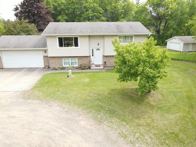 11236 207th Ave NW, Elk River, MN 55330 - raised ranch featuring a front yard, brick siding, an attached garage, and driveway