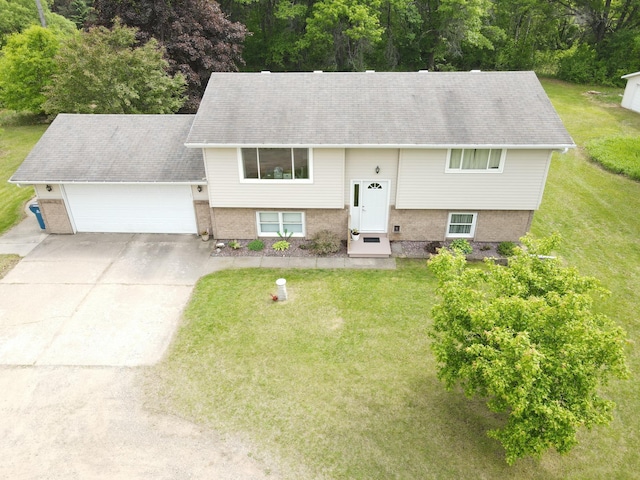 11236 207th Ave NW, Elk River, MN 55330 - split foyer home with a garage, a front yard, and concrete driveway
