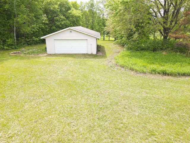 11236 207th Ave NW, Elk River, MN 55330 - view of green lawn with a detached garage and an outdoor structure