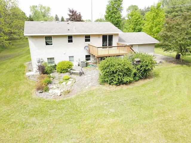 11236 207th Ave NW, Elk River, MN 55330 - rear view of house with a wooden deck, a lawn, central AC, a patio area, and a shingled roof