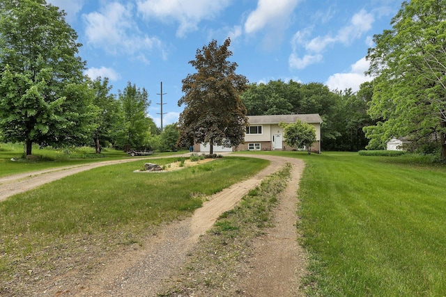 11236 207th Ave NW, Elk River, MN 55330 - view of front facade featuring dirt driveway and a front yard
