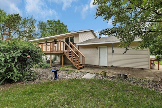 11236 207th Ave NW, Elk River, MN 55330 - back of property featuring stairway, a wooden deck, and a lawn