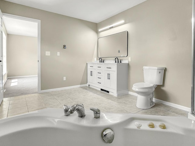 7658 Silver Lake Rd, Mounds View, MN 55112 - bathroom with tile patterned floors, double vanity, toilet, and baseboards