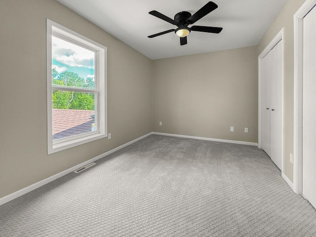 7658 Silver Lake Rd, Mounds View, MN 55112 - unfurnished bedroom with carpet flooring, baseboards, ceiling fan, and a closet