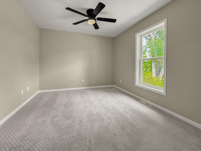 7658 Silver Lake Rd, Mounds View, MN 55112 - carpeted spare room with ceiling fan and baseboards