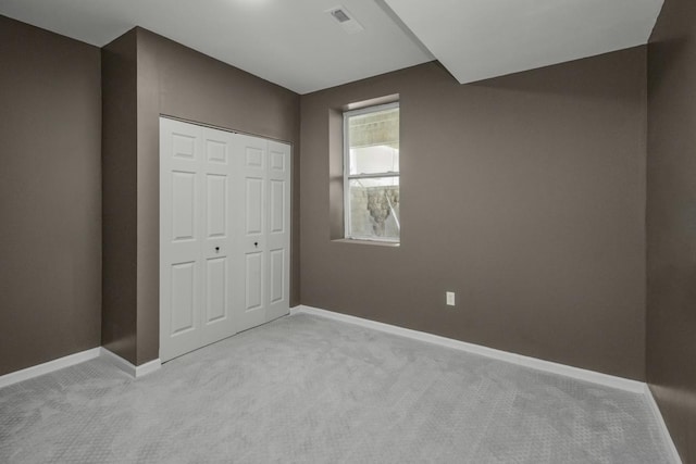 7658 Silver Lake Rd, Mounds View, MN 55112 - unfurnished bedroom with carpet flooring, baseboards, and a closet