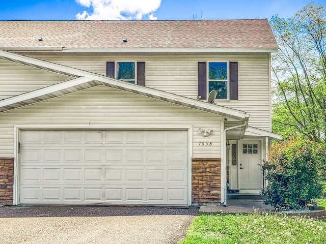 7658 Silver Lake Rd, Mounds View, MN 55112 - view of front facade featuring asphalt driveway and roof with shingles