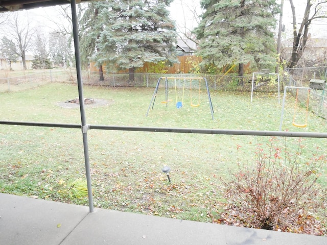 1996 Kingston Ave E, Maplewood, MN 55109 - fenced backyard featuring a playground