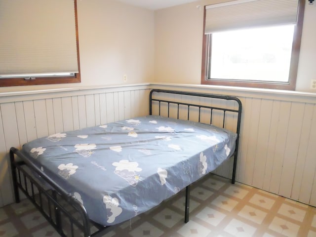 1996 Kingston Ave E, Maplewood, MN 55109 - bedroom with a wainscoted wall and tile patterned floors