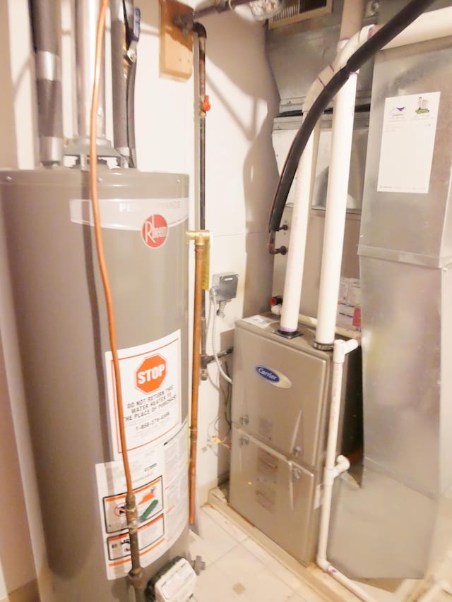 1996 Kingston Ave E, Maplewood, MN 55109 - utility room featuring gas water heater and heating unit